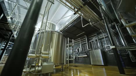 modern craft brewery. craft beer production. modern equipment in brewery, metal tanks, alcoholic drink production