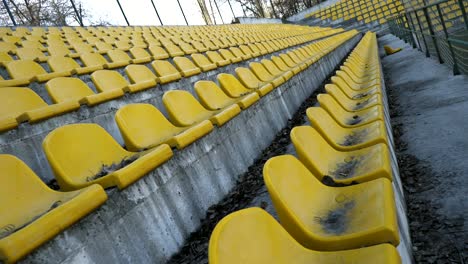 yellow chairs in an empty stadium, 4k