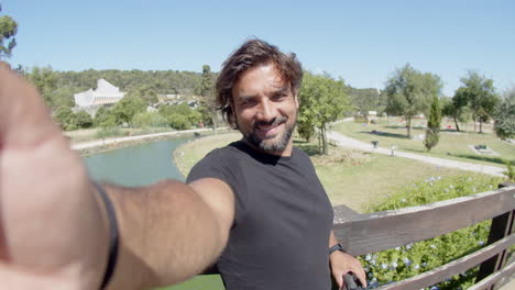 pov of happy athlete taking photo in summer city park