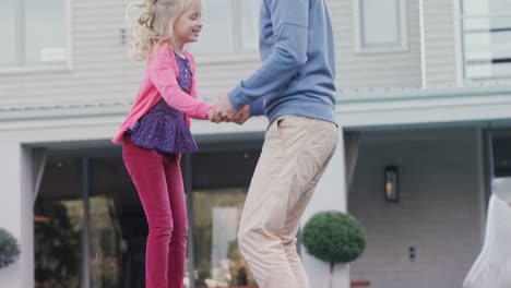 Father-and-daughter-bouncing-on-the-trampoline-4k