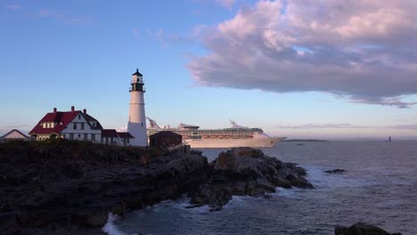 remarkable shot of the portland head lighthouse in maine with cruise ship passing in distance