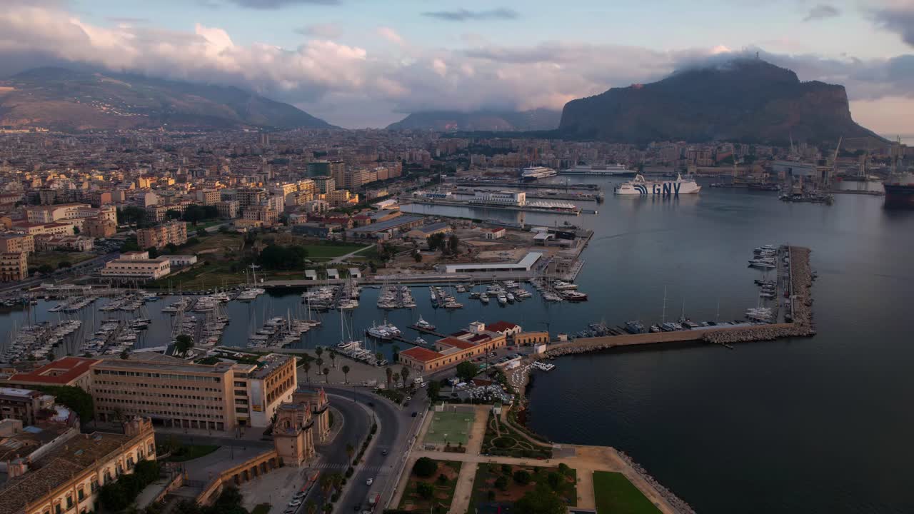 Palermo old town time-lapse. Harbor with cruise ship entering the port. Sicily Italy sunset aerial