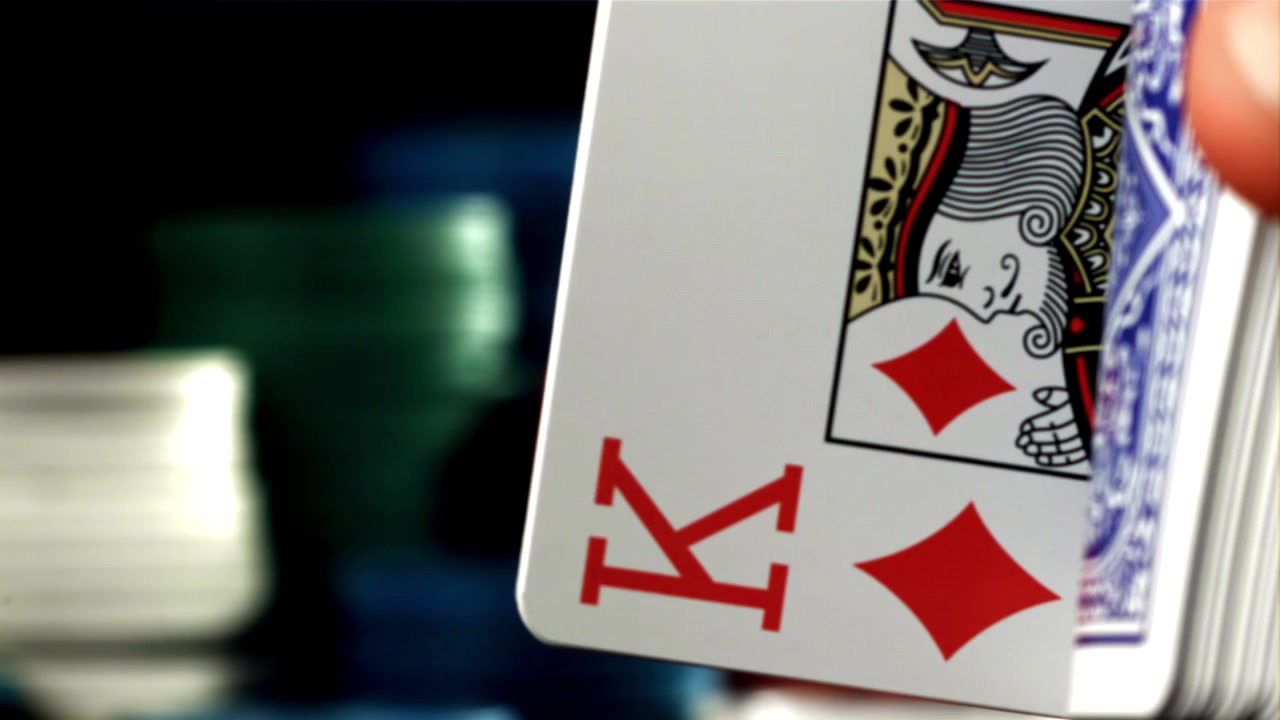 Close-up of Hand Flipping Through a Deck of Playing Cards