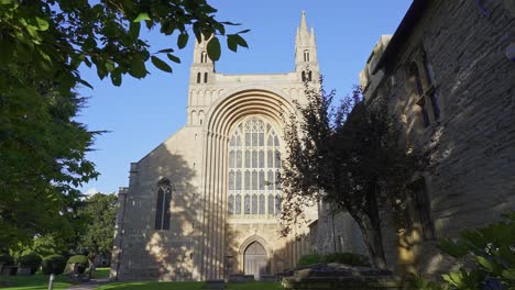 the huge gothic stained glass window on the medieval west front of tewkesbury abbey