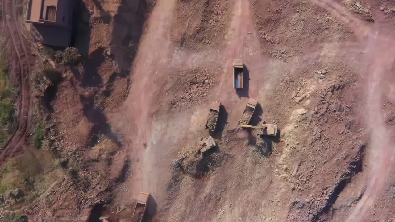 Concept of environmental destruction impact showing Quarry landscape with heavy industry machinery and dust filling the air, deforested landscape affecting environment