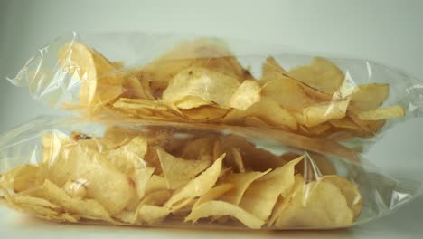 Potato-chips-in-a-plastic-packet-,