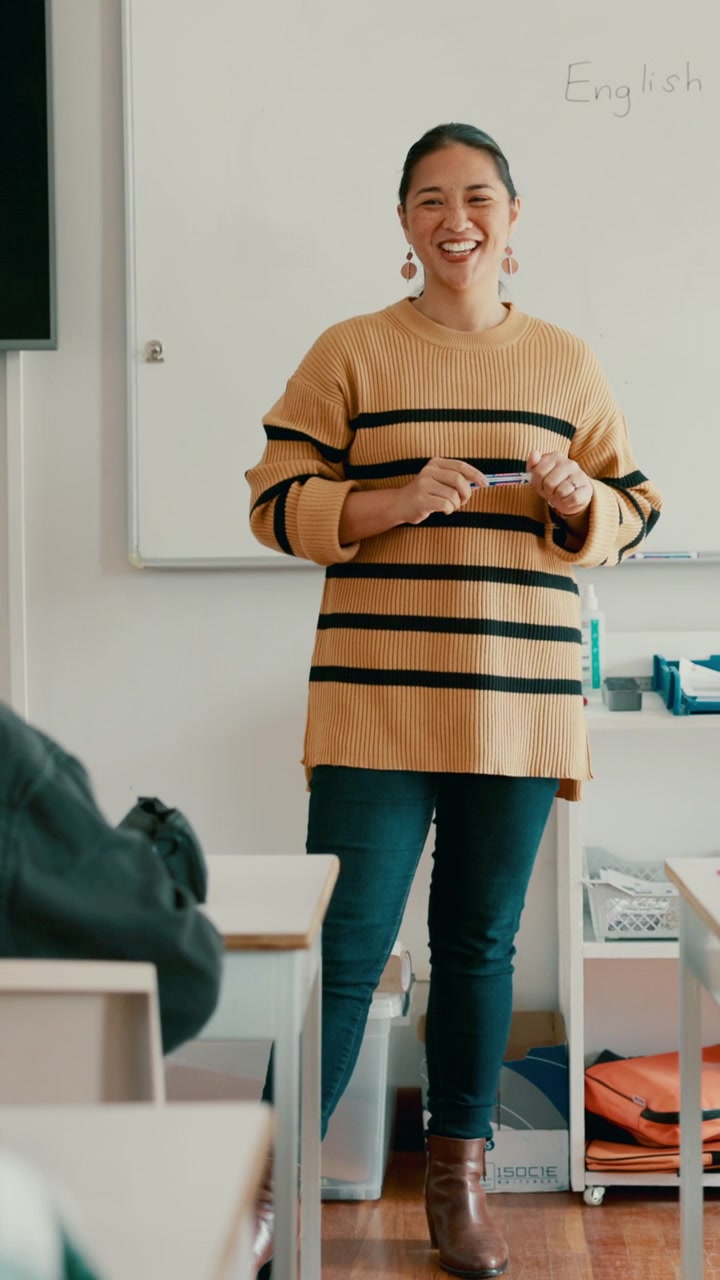 Female Teacher Giving a Lesson in a Classroom