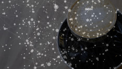 dark ceramic coffee cup showing latte art from overhead in 3d render, overlaying network node grid