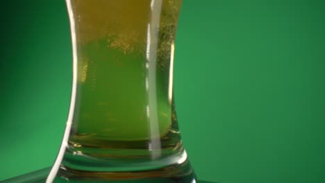 bubbles of beer floating inside a glass of beer