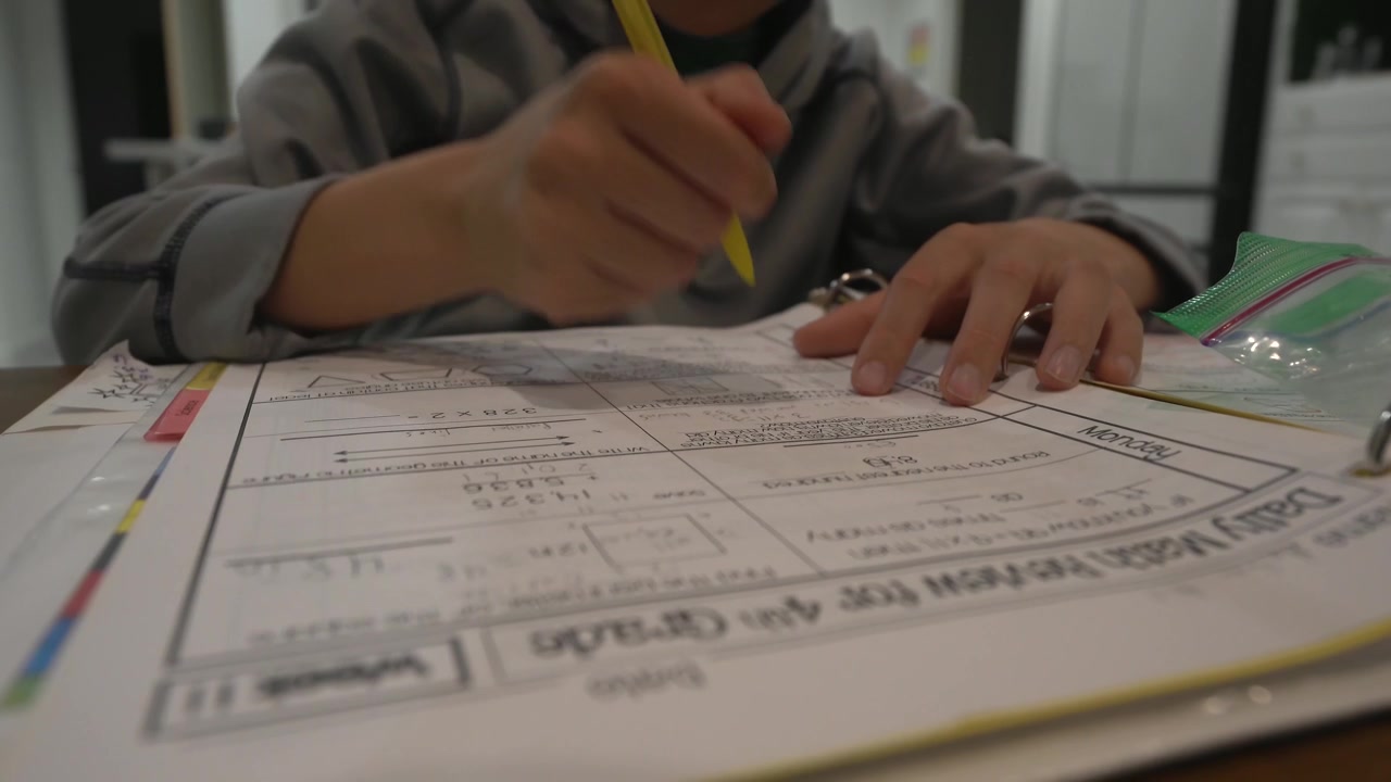 Child Doing Math Homework; Front Low Angle View.