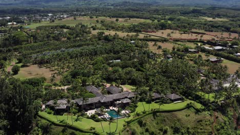 Low-tilting-up-aerial-shot-of-a-luxury-resort-in-Princeville-on-the-North-Shore-on-Kaua'i,-Hawai'i