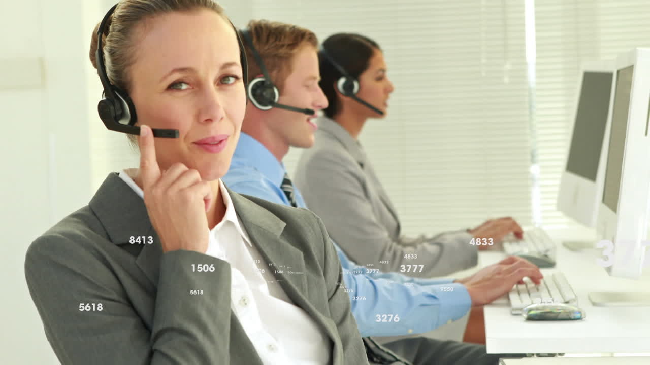 Animation of numbers changing over business people wearing phone headsets