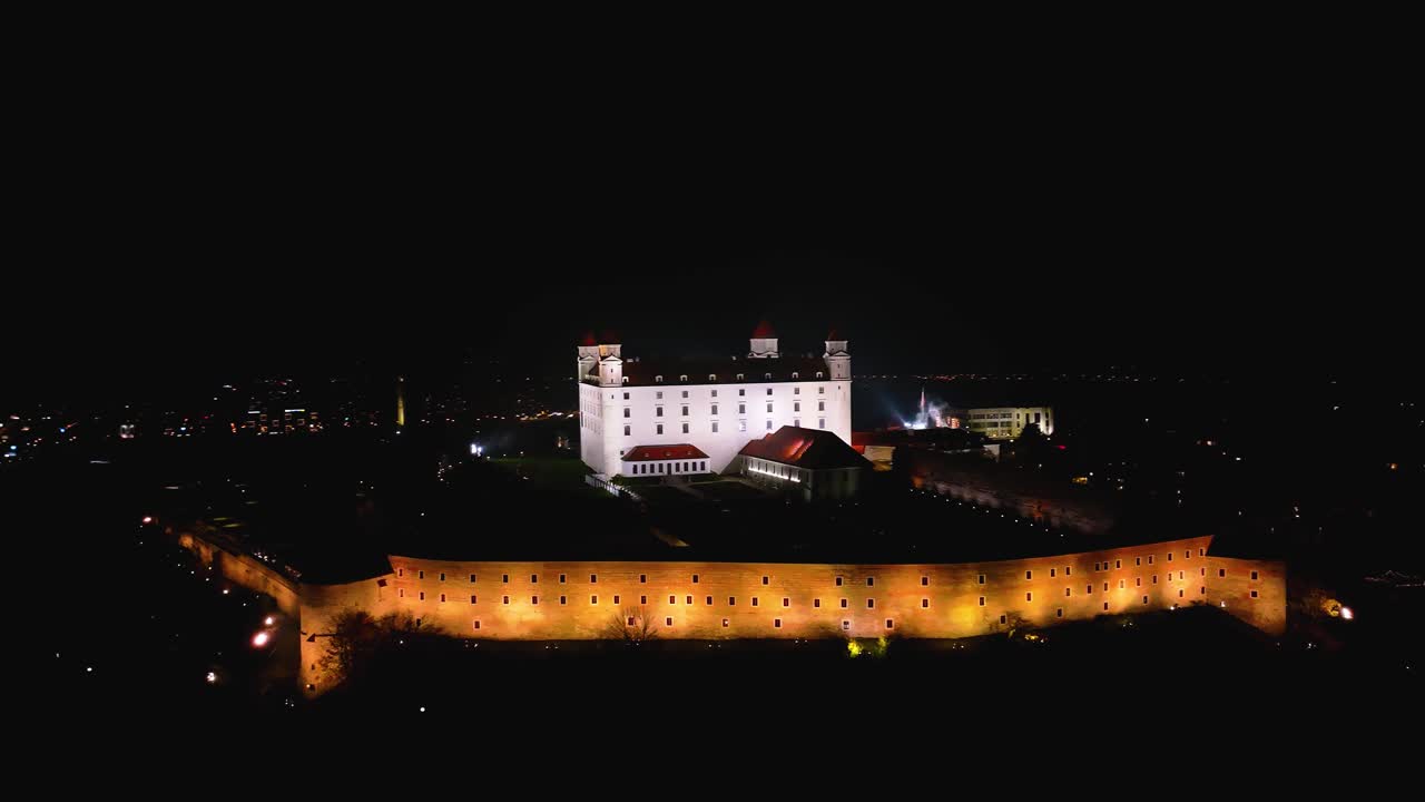 4K cinematic drone shot of Bratislava Castle illuminated at night — Slovakia_033