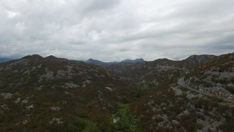 mountainous landscape with road and cloudy sky