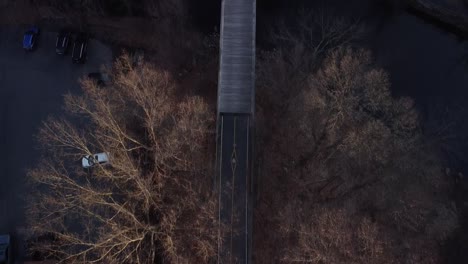 bird's eye view of a bicycle walking path rail trail in winter