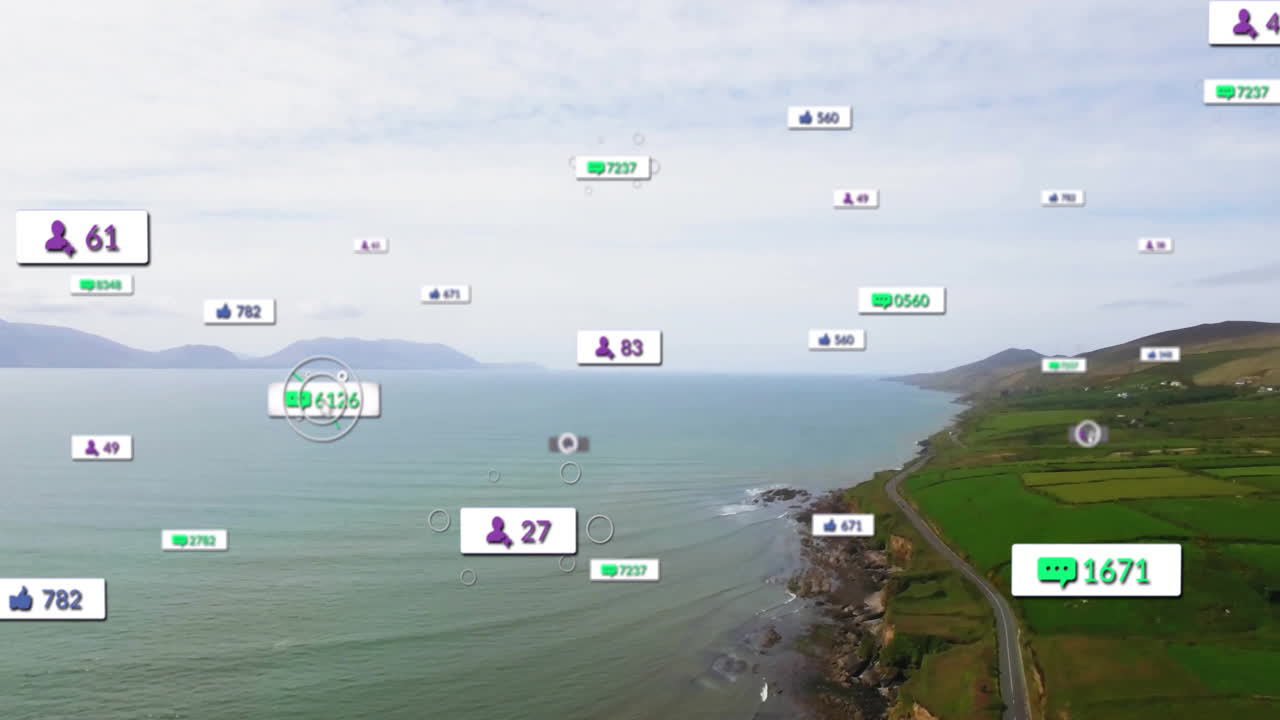 Floating animation of social media icons over ocean and cliffs in coastal landscape