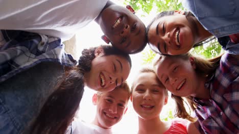 Schoolkids-forming-huddle-in-school-premises-4k