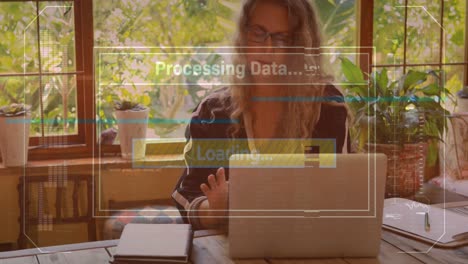 Animación-De-La-Interfaz-Con-Procesamiento-De-Datos-Contra-Una-Mujer-Mayor-Caucásica-Usando-Una-Computadora-Portátil-En-Casa