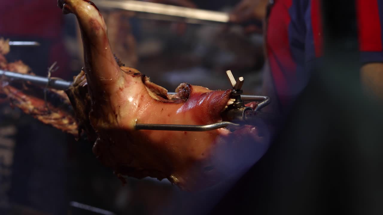 Street Food. Pork and Portuguese traditional spicy sausages being cooked over hot charcoal fire