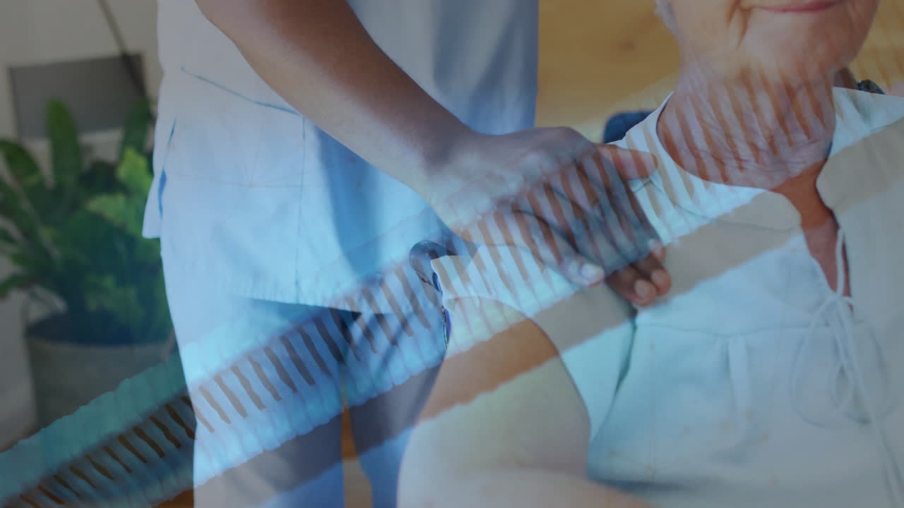 Animation of dna strand over african american female doctor and senior caucasian woman