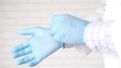 doctor putting on gloves