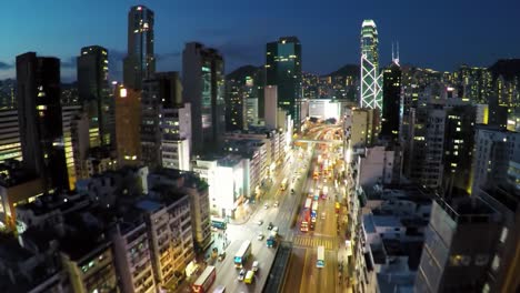 this captivating view reveals the dynamic nightlife of hong kong, with illuminated skyscrapers lining busy streets filled with vehicles and energy. the urban landscape is alive and exciting.