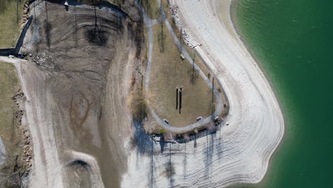 Top-Down-of-Beach-at-Lake-Lungern,-Obwalden,-Switzerland