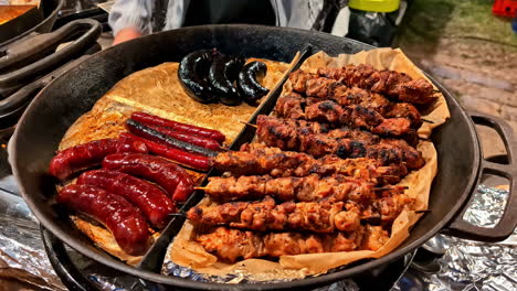 cooked meat skewers with crispy edges and darkened surface ready to eat on plate
