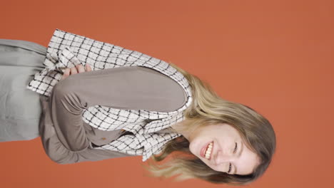 Vertical-video-of-Young-woman-smiling-at-camera