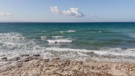 cinematic sea and ocean waves glide across the sand