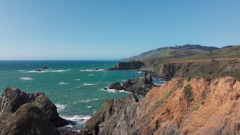 Drone-shot-flying-close-over-a-cliff-off-the-pacific-northwest-coastline