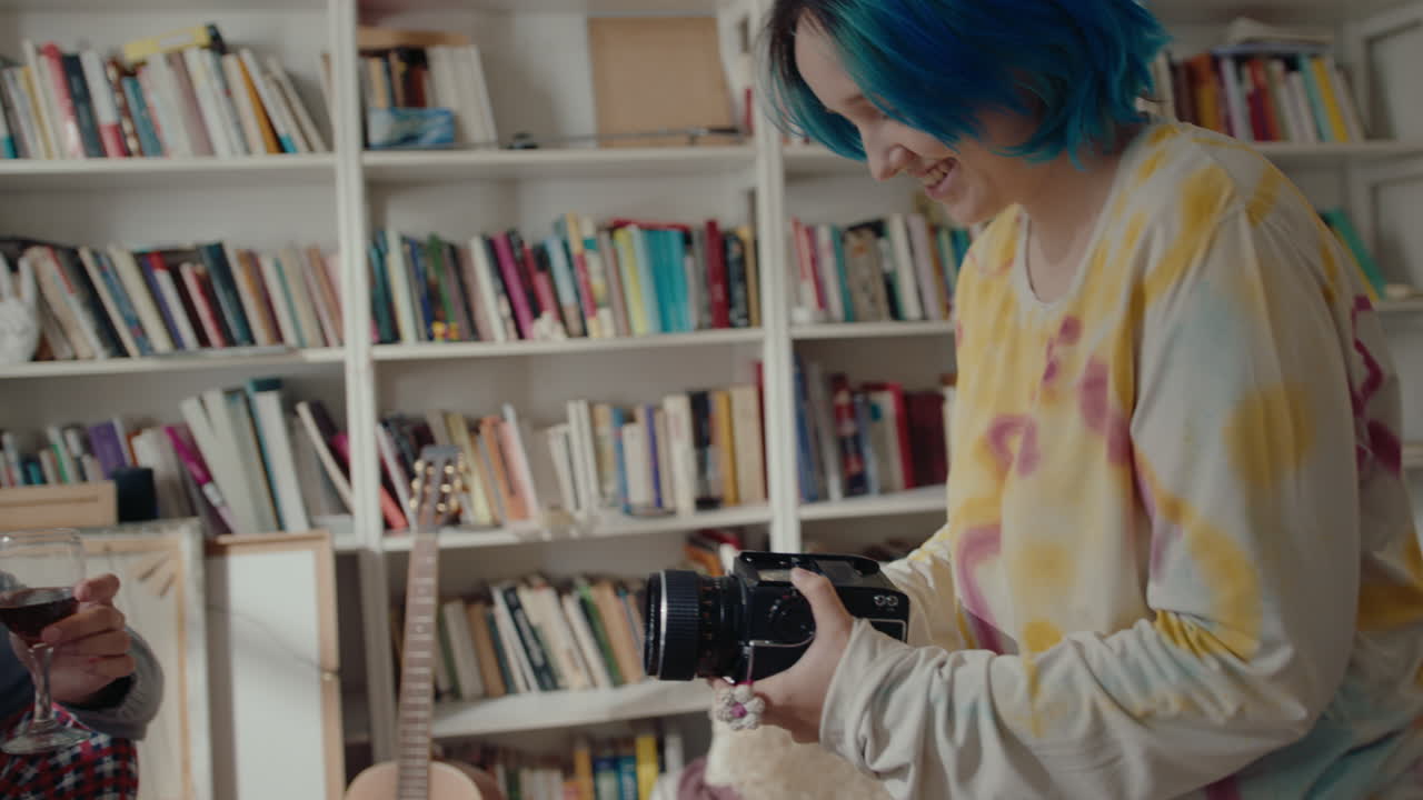 Girl Filming Her Boyfriend Drinking Wine at Home Recording Studio