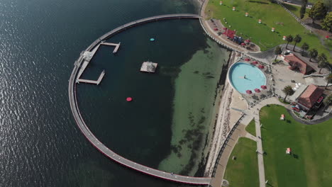 AERIAL-Over-Circular-Boardwalk-Swimming-Area-And-Pool,-Geelong