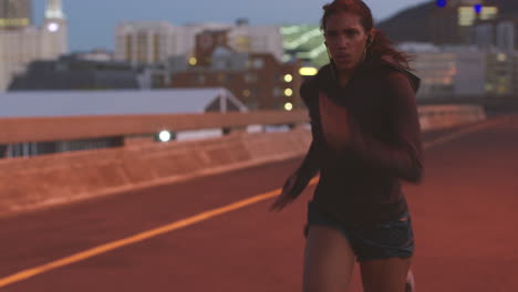 woman running in city at night