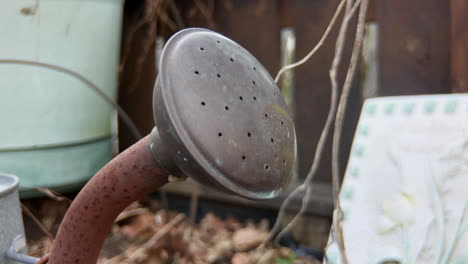 Close up of rusty watering can spout