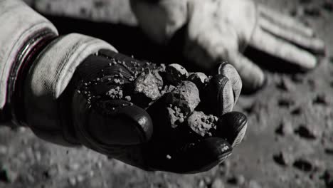 Close-up-of-Astronaut-holding-Regolith-on-the-Moon