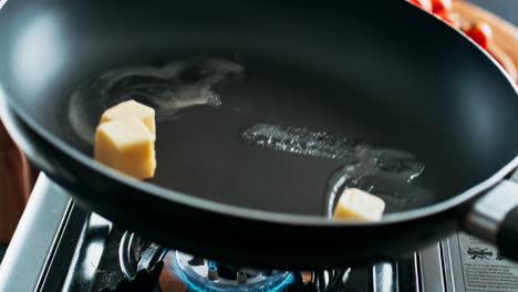 butter melting in a pan
