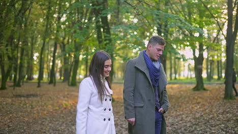 couple walking in a park in the fall