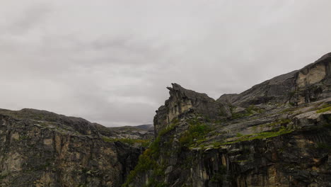 aerial approach toward the canon rock formation in dramatic alpine landscape