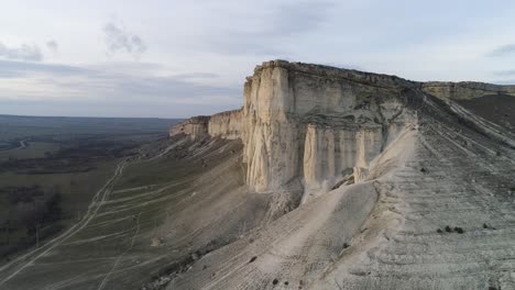 aerial view of a dramatic limestone cliff face