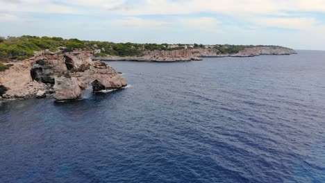 the beautiful drone shot of the coast and blue sea in mallorca