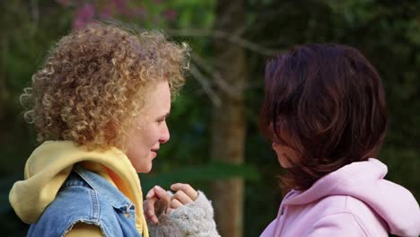 close encounter between two women in a park
