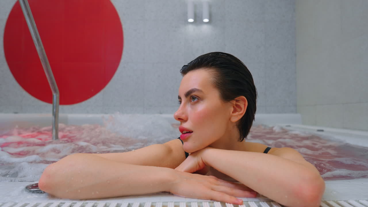 Woman Relaxing in a Modern Spa Hot Tub
