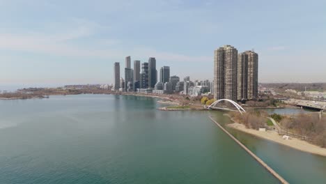 toronto aerial of gardiner expressway, lake ontario, condos, and humber bay park area, panoramic dolly