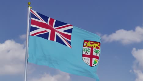 bandera de fiji moviéndose en el viento con un cielo azul claro en el fondo, nubes moviéndose lentamente, asta de la bandera, cámara lenta