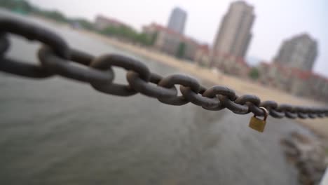 love lock on a chain guard rail on the lake side boardwalk in down town kelowna