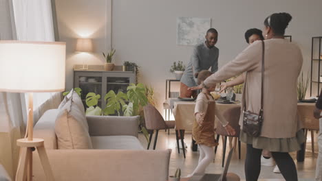 a family hugging together in their living room