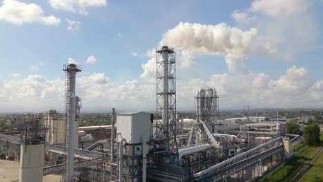 aerial view of oil and gas refining petrochemical factory with high refinery plant manufacture structure. global production and manufacturing concept