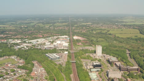 aerial shot over long straight train tracks