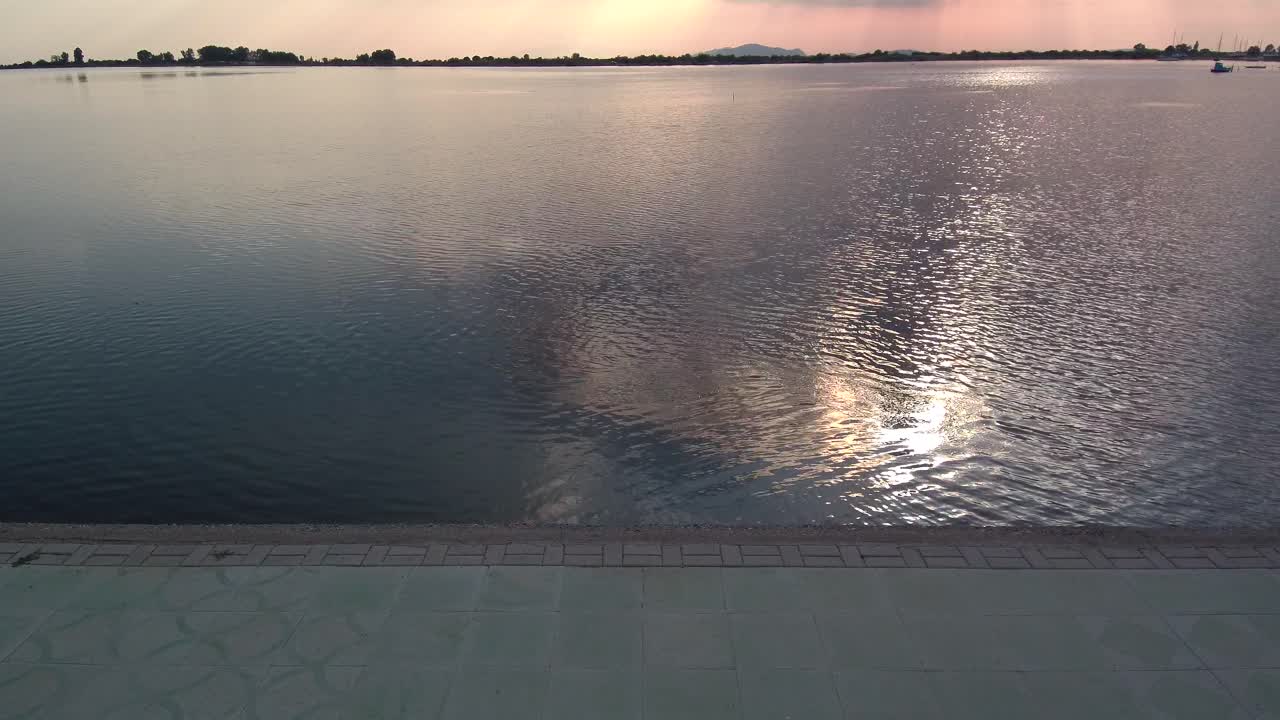 Water pollution with the sun reflection in the grey water